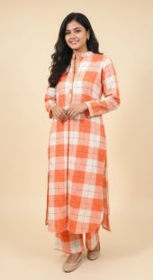 Woman wearing an orange and white checkered dress on a beige background