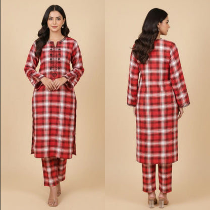 Red and white checkered outfit worn by a model on a beige background
