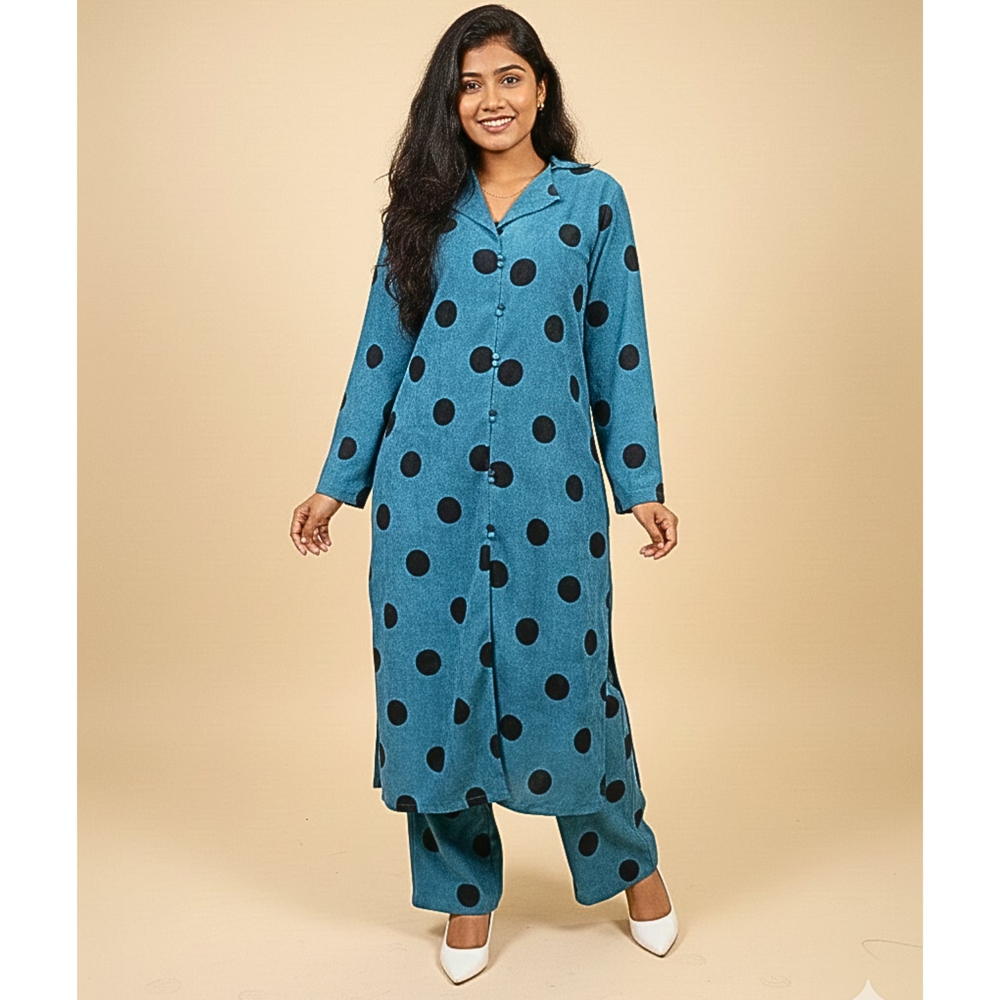 Woman wearing a blue polka dot outfit on a beige background