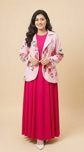 Woman wearing a pink floral jacket and red dress on a beige background